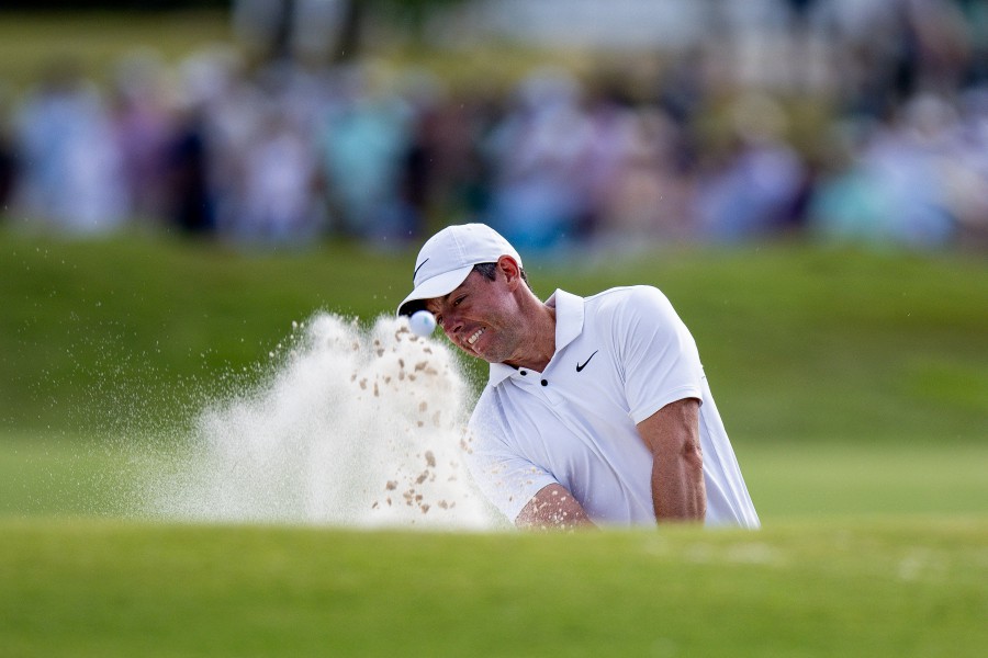 Rory McIlroy plays his shot from a bunker on the 18th hole during the final round of the Zurich Classic of New Orleans golf tournament. - REUTERS PIC