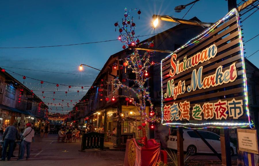 Siniawan Night Market, with its picturesque wooden townhouses and Chinese lanterns, is a haven for photographers. - File pic credit (Sarawak Tourism Board)