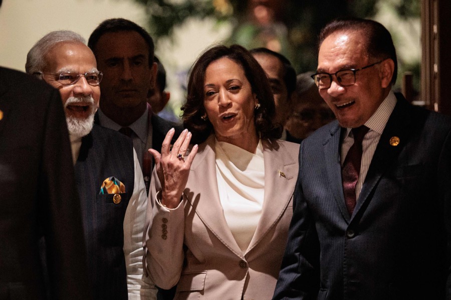 US Vice President Kamala Harris (C) talks with India's Prime Minister Narendra Modi (L) and Prime Minister Datuk Seri Anwar Ibrahim as they enter to attend the 18th East Asia Summit as part of the 43rd Association of Southeast Asian Nations (Asean) Summit in Jakarta. - AFP PIC