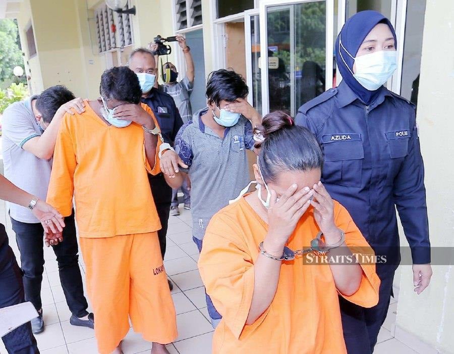 The four suspects are led by police officers at Selayang Sessions Court. -NSTP/SAIFULLIZAN TAMADI.