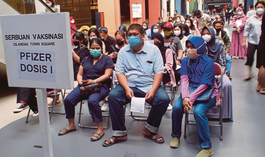 People waiting to get vaccinated in Jakarta. -EPA pic