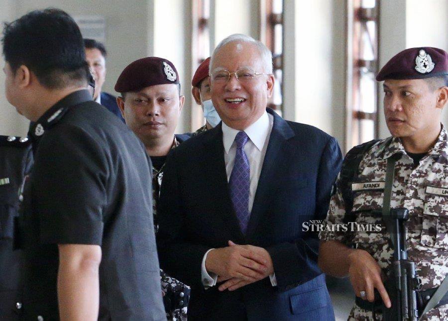 Datuk Seri Najib Razak reacts as he arrives at the Kuala Lumpur High Court ahead of his trial on Aug 9, 2023 in Kaula Lumpur.- NSTP/EIZAIRI SHAMSUDIN