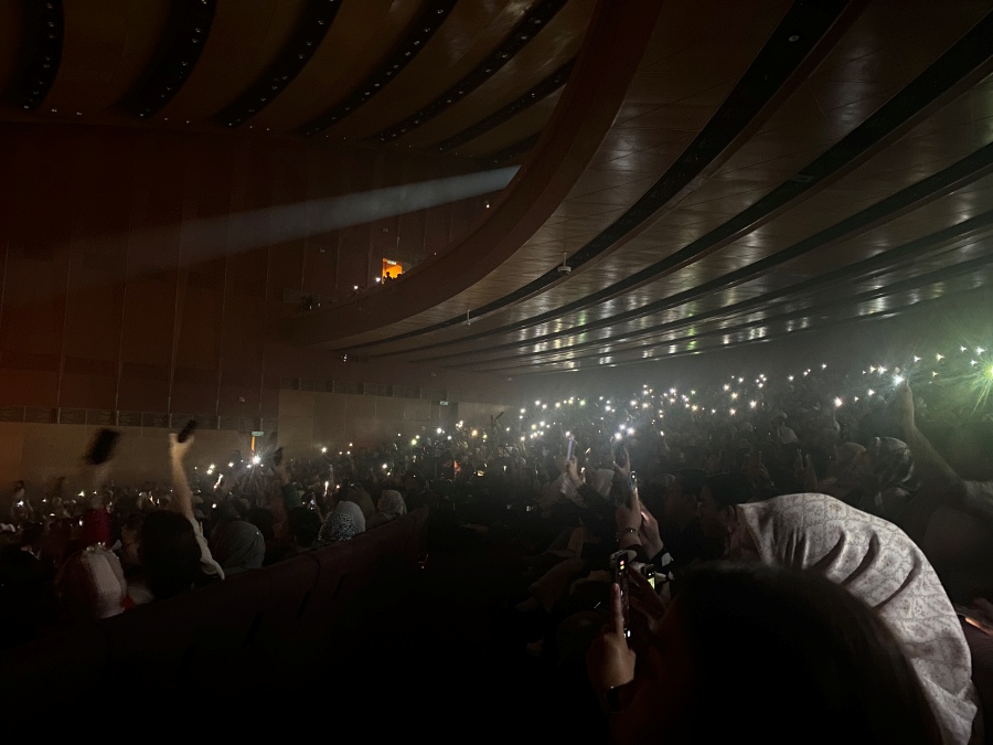 The emotional high point came during Afgan's rendition of "Jodoh Pasti Bertemu," with the entire hall illuminated by phone flashlights.