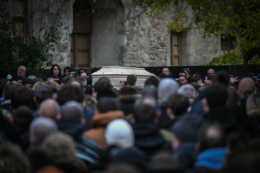 The coffin of Thomas, a teenager who passed away on November 19, 2023 in Crepol after being wounded with a knife during a ball in the small village in the Drome region, is carried during his funerals at the entrance of the Collegiate church of Saint-Donat-sur-l'Herbasse, south-eastern France, on November 24, 2023. - AFP PIC