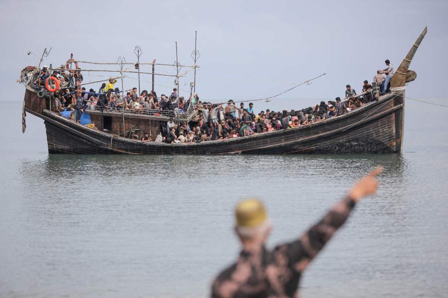 Newly arrived Rohingya refugees are stranded on a boat after the nearby community decided not to allow them to land after giving them water and food in Pineung, Aceh province on November 16, 2023. - AFP FILE PIC