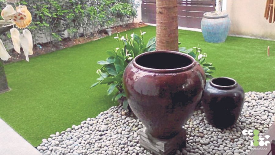 Before and after effect of a garden area after artificial grass is "planted".