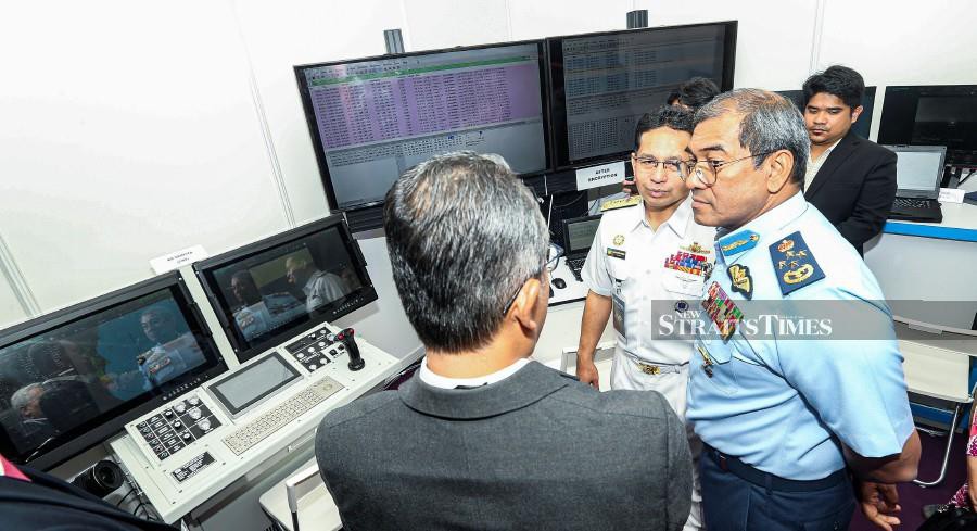 Air Force chief General Tan Sri Datuk Seri Mohd Asghar Khan Goriman Khan (left) said developed since 2019, ADAM had obtained the Malaysian Cryptography Validation from CyberSecurity Malaysia on Sept 30. - NSTP/OWEE AH CHUN