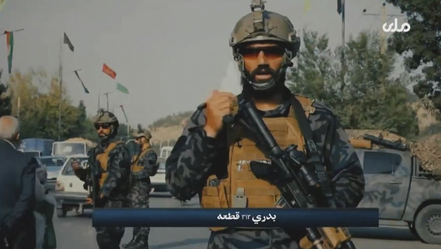 A video grab taken from Afghan TV RTA shows propaganda images of Taliban's Badri 313 Special Forces patrolling streets in an unidentified location in Afghanistan. (Photo by - / various sources / AFP) 