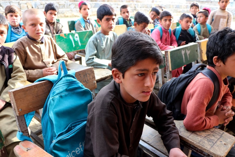 Afghan school boys attend their first class following the start of the new academic year, at a school in Charikar city of Parwan province. (Photo by Abdul SHAHMIM TANHA / AFP)