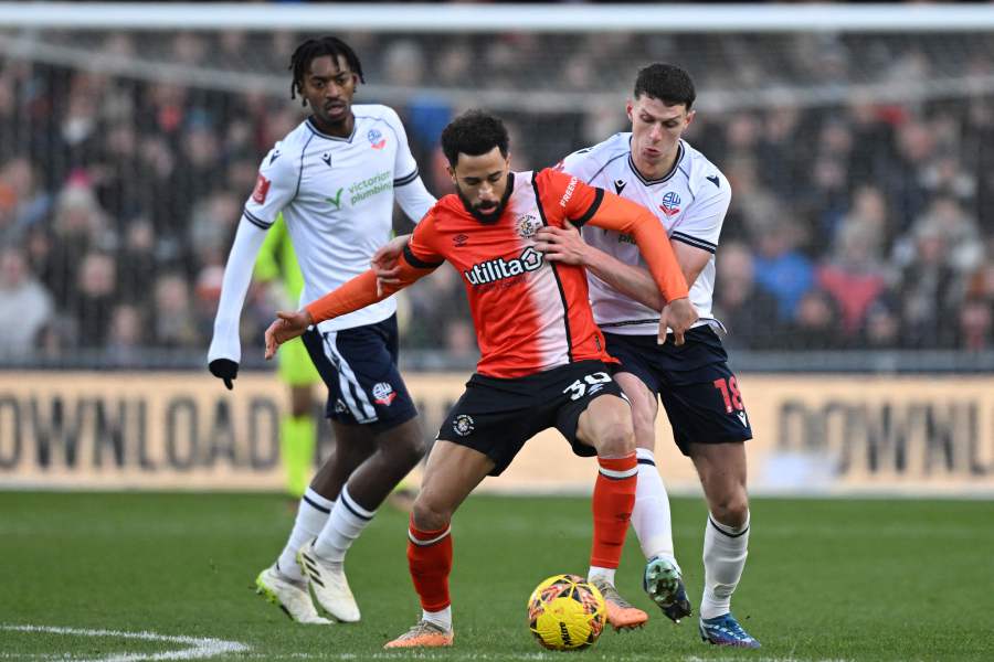 Luton Town's English midfielder #30 Andros Townsend (C) vies with Bolton Wanderers' Northern Irish defender #18 Eoin Toal (R) during the English FA Cup third round football match between Luton Town and Bolton Wanderers at Kenilworth Road in Luton, north of London on January 7, 2024. - AFP pic