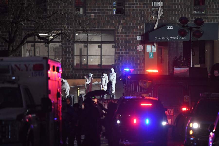 Emergency first responders work outside an apartment building after a deadly fire in the Bronx. - AFP Pic