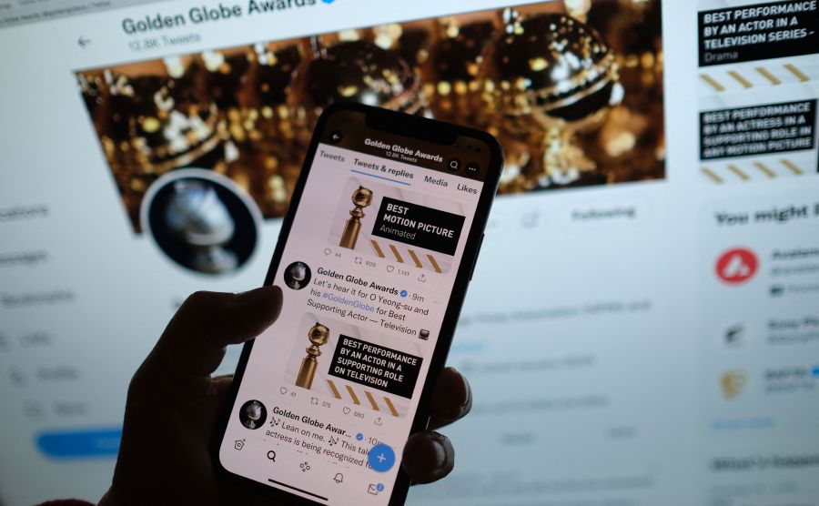 This illustration photo shows a person checking the Golden Globe Awards online via the Golden Globes Twitter account, in Los Angeles. - AFP Pic