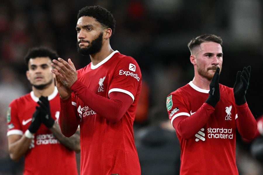Liverpool's Colombian midfielder #07 Luis Diaz (L), Liverpool's English defender #02 Joe Gomez (C) and Liverpool's Argentinian midfielder #10 Alexis Mac Allister applauds the fans following the English League Cup semi-final first leg football match between Liverpool and Fulham on January 10, 2024.- AFP pic