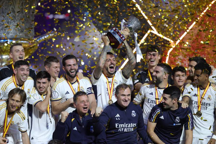 Real Madrid's Spanish forward #14 Joselu lifts the trophy as he celebrates with his teammates after winning the Spanish Super Cup final football match against Barcelona at Al-Awwal Park Stadium in Riyadh, on January 14, 2024.- AFP pic