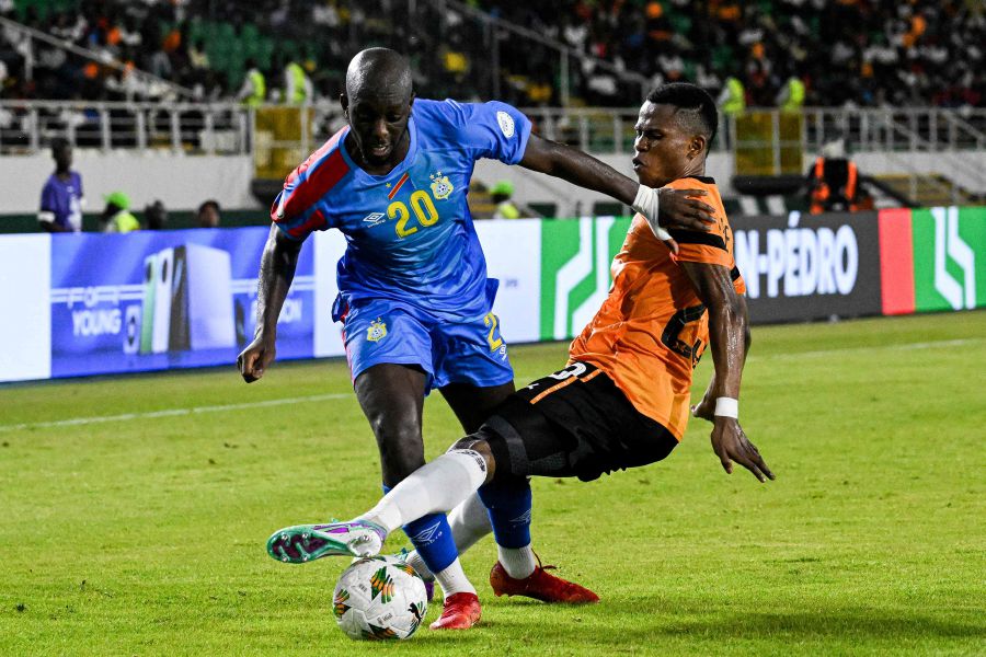 DR Congo's forward #20 Yoane Wissa (L) fights for the ball with Zambia's defender #23 Rodrick Kabwe during the Africa Cup of Nations (CAN) 2024 group F football match between DR Congo and Zambia on January 17, 2024.- AFP pic