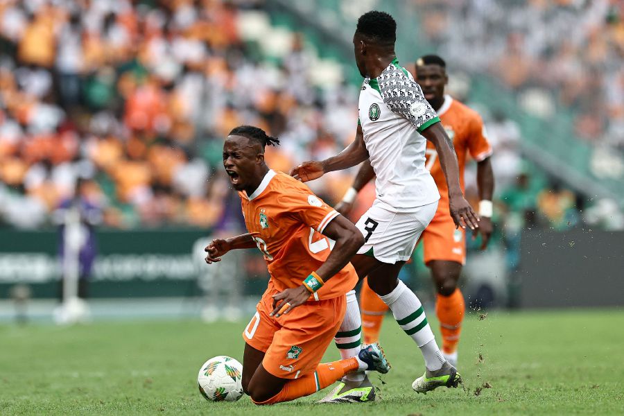 Ivory Coast's forward #20 Christian Kouame (L) fights for the ball with Nigeria's defender #3 Zaidu Sanusi (C) during the Africa Cup of Nations (CAN) 2024 group A football match between Ivory Coast and Nigeria on January 18, 2024.- AFP pic