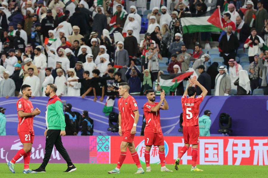 Palestine's players salute the attendance after the Qatar 2023 AFC Asian Cup Group C football match between Palestine and United Arab Emirates on January 18, 2024.- AFP pic