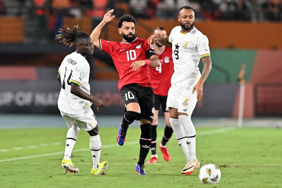 Egypt's forward #10 Mohamed Salah fights for the ball with Ghana's defender #14 Gideon Mensah and Ghana's forward #9 Jordan Ayew during the Africa Cup of Nations (CAN) 2024 group B football match between Egypt and Ghana on January 18, 2024. - AFP pic