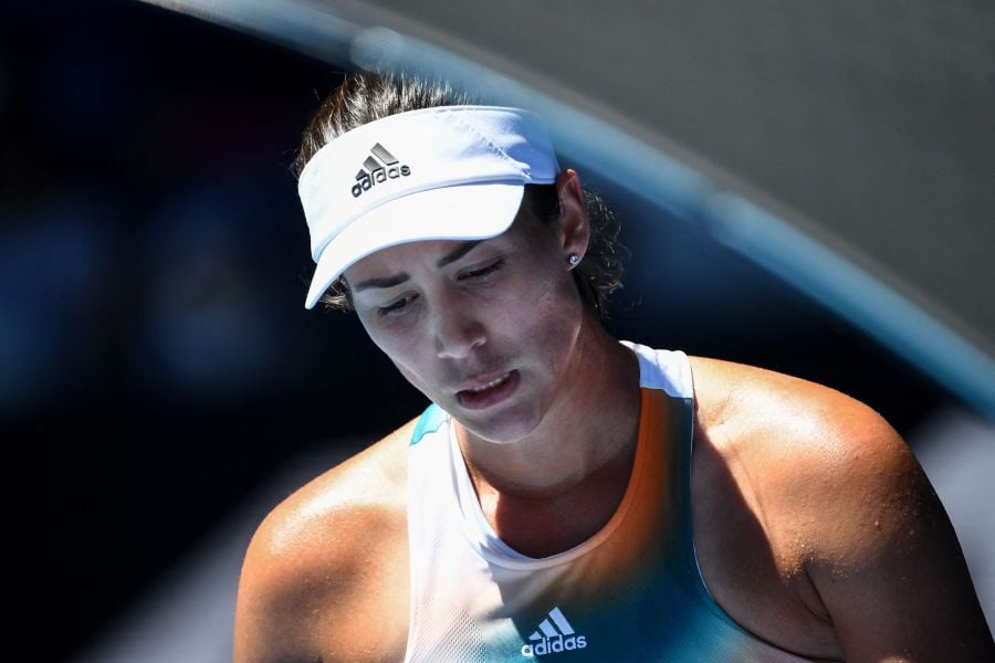 Spain's Garbine Muguruza reacts after a point against France's Alize Cornet during their women's singles match on day four of the Australian Open tennis tournament in Melbourne. - AFP Pic