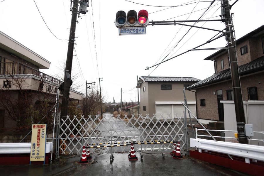 This file photo taken on March 5, 2018 shows a closed gate to prevent people from entering the exclusion zone in Futaba town, Fukushima prefecture, after the devastating 2011 earthquake and tsunami that triggered the Fukushima nuclear disaster. - AFP Pic