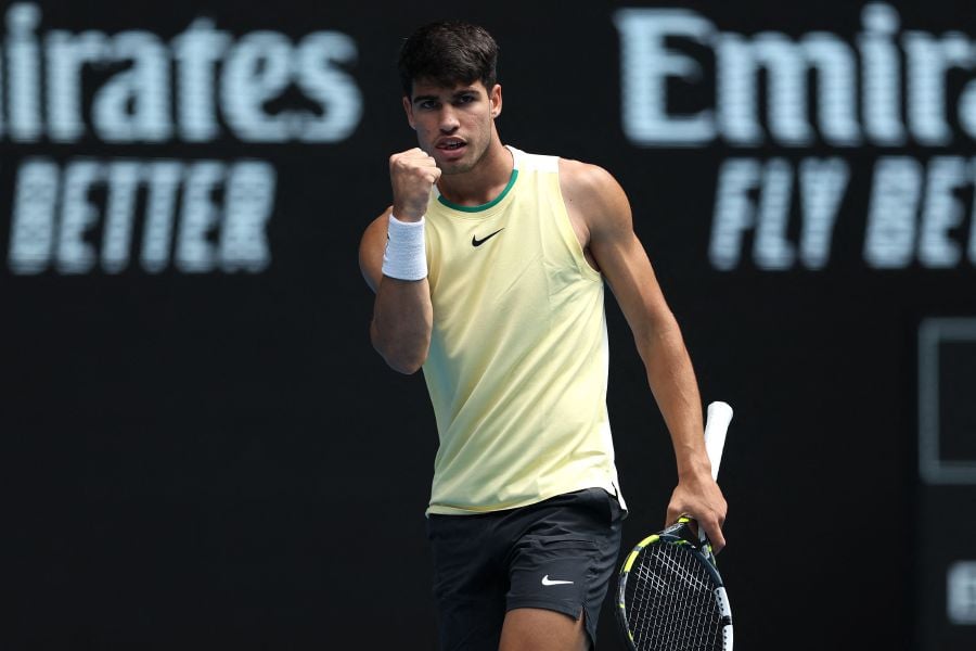 Spain's Carlos Alcaraz reacts on a point against China's Shang Juncheng during their men's singles match on day seven of the Australian Open tennis tournament on January 20, 2024. - AFP pic