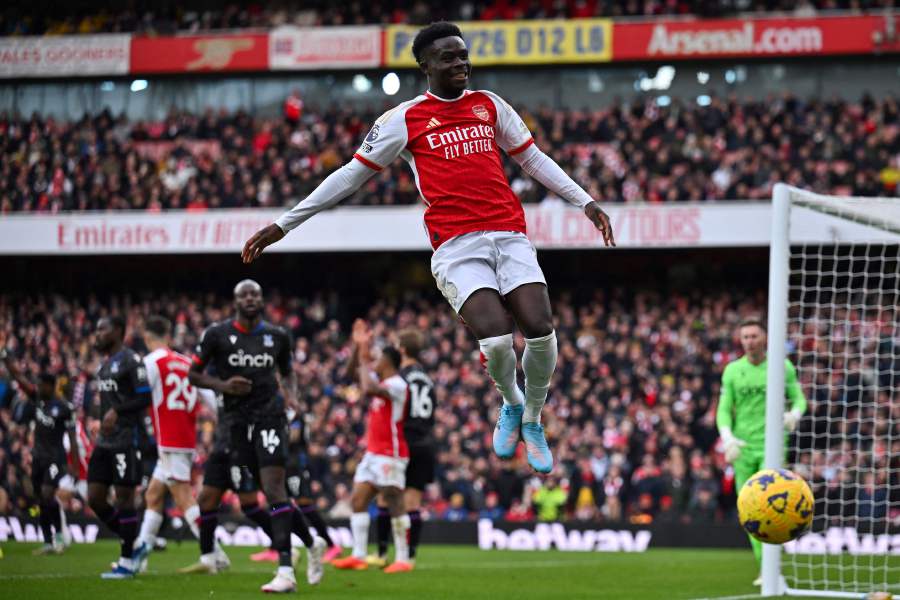 Arsenal's English midfielder #07 Bukayo Saka jumps for the ball during the English Premier League football match between Arsenal and Crystal Palace at the Emirates Stadium on January 20, 2024. - AFP pic