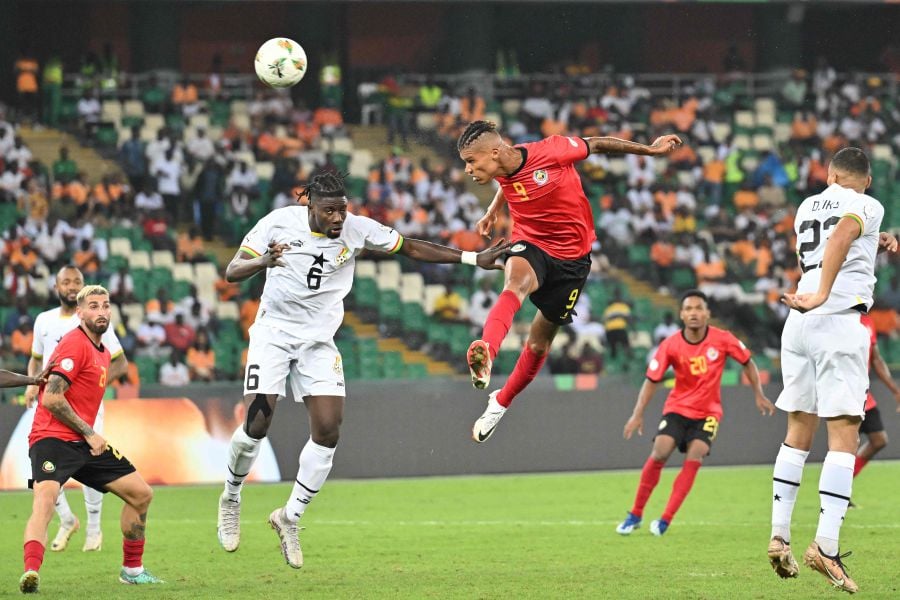 Mozambique's forward #9 Lau King heads the ball while being challenged by Ghana's defender #6 Mohammed Salisu during the Africa Cup of Nations (CAN) 2024 group B football match between Mozambique and Ghana on January 22, 2024.- AFP pic