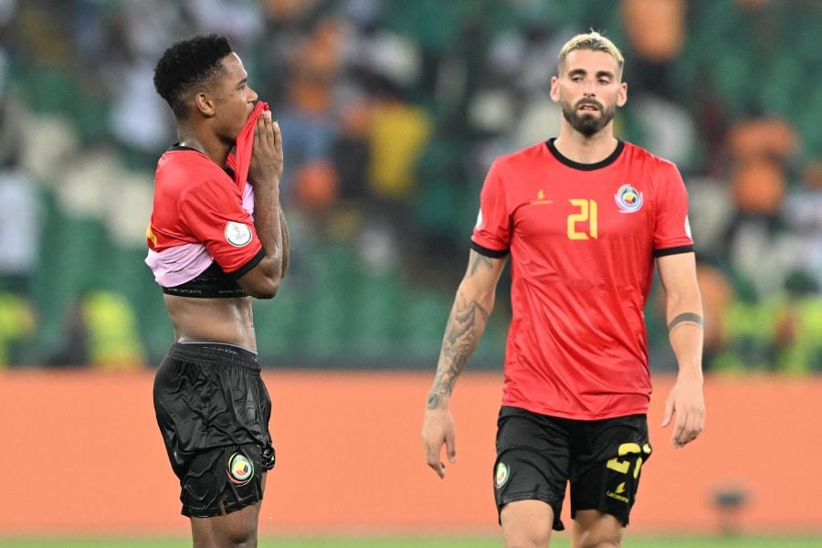 Mozambique's forward #20 Geny Catamo (L) and Mozambique's midfielder #21 Guima react after the draw with Ghana during the Africa Cup of Nations (CAN) 2024 group B football match between Mozambique and Ghana on January 22, 2024. - AFP pic