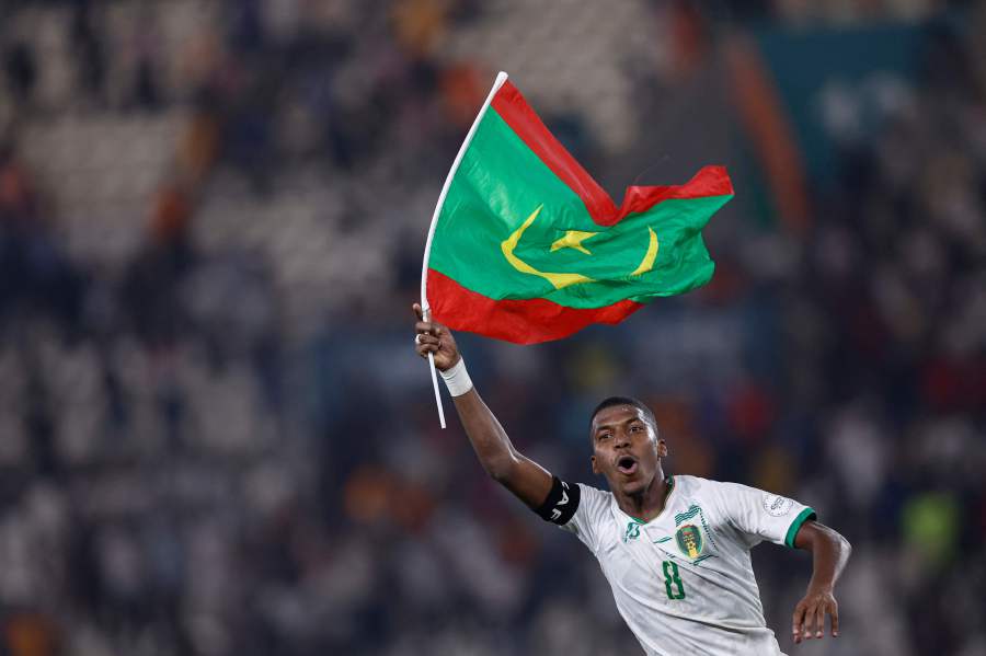 Mauritania's midfielder #8 Bodda Mouhsine holds a Mauritania flag after his team won the Africa Cup of Nations (CAN) 2024 group D football match between Mauritania and Algeria on January 23, 2024. - AFP pic
