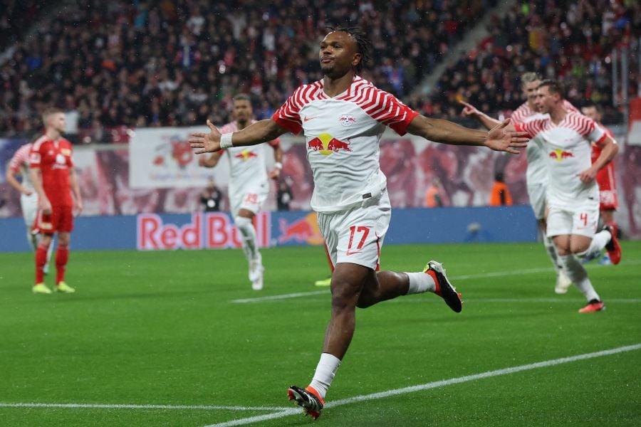 Leipzig's Belgian forward #17 Lois Openda (C) celebrates scoring the opening goal with his teammates during the German first division Bundesliga football match between RB Leipzig and Union Berlin in Leipzig, eastern Germany on February 4, 2024. - AFP pic