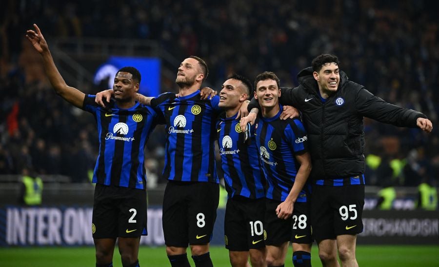 (From L) Inter Milan's Dutch defender #02 Denzel Dumfries, Inter Milan's Austrian forward #08 Marko Arnautovi?, Inter Milan's Argentine forward #10 Lautaro Martinez, Inter Milan's French defender #28 Benjamin Pavard and Inter Milan's Italian defender #95 Alessandro Bastoni celebrate their team's 1-0 victory after winning the Serie A football match between Inter Milan and Juventus. - AFP pic