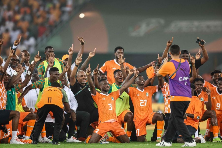 Ivory Coast's players celebrate after winning at the end of the Africa Cup of Nations (CAN) 2024 semi-final football match between Ivory Coast and Democratic Repuplic of Congo on February 7, 2024. - AFP pic