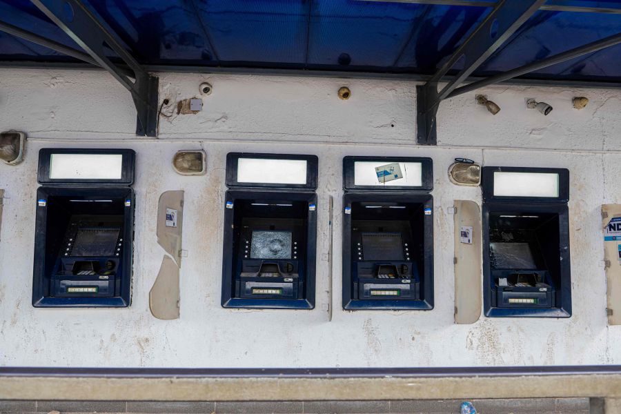 Damaged ATM's are seen outside the premises of a local bank in Abeokuta, Nigeria, on February 7, 2023 after a demonstration by angry residents. -- AFP Pic