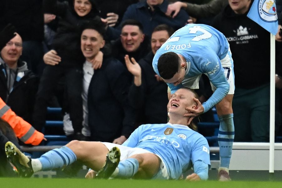 Manchester City's Norwegian striker #09 Erling Haaland (C) celebrates with Manchester City's English midfielder #47 Phil Foden (R) after scoring their third goal during the English Premier League football match between Manchester City and Manchester United on March 3, 2024. - AFP pic