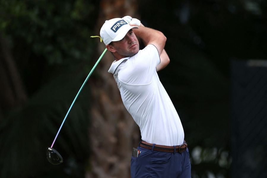 Austin Eckroat of the United States plays his shot from the third tee during the final round of The Cognizant Classic in The Palm Beaches at PGA National Resort And Spa. - AFP pic