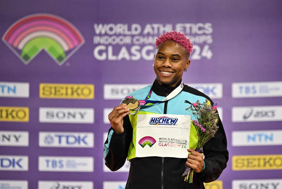 Gold medallist Bahamas' Devynne Charlton celebrates on the podium after competing in the Men's 60m hurdles final during the Indoor World Athletics Championships in Glasgow, Scotland, on March 3, 2024. - AFP pic