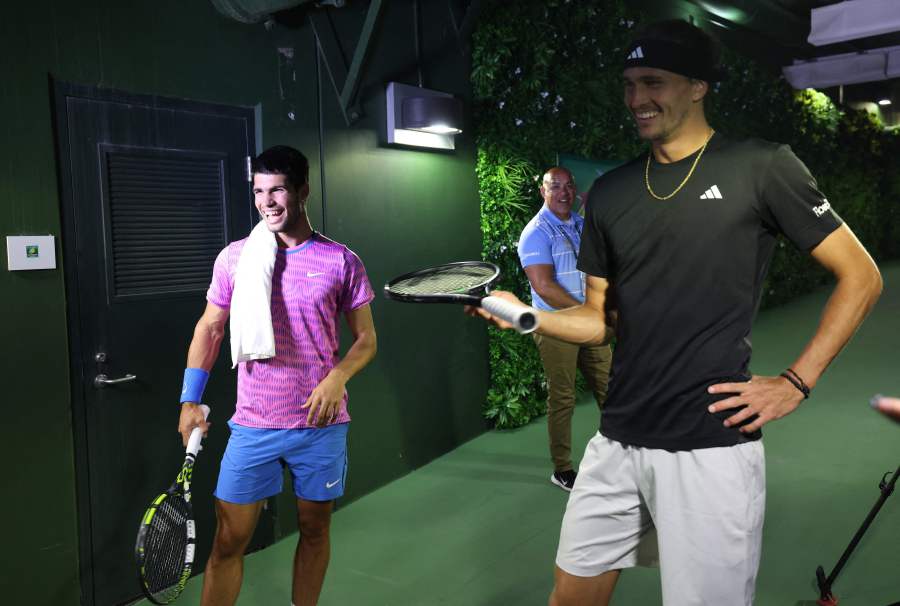 Carlos Alcaraz of Spain and Alexander Zverev of Germany watch on a TV monitor in the players tunnel after running in for cover from a swarm of bees that suddenly invaded the court whilst playing in their Quarterfinal match during the BNP Paribas Open. - AFP pic