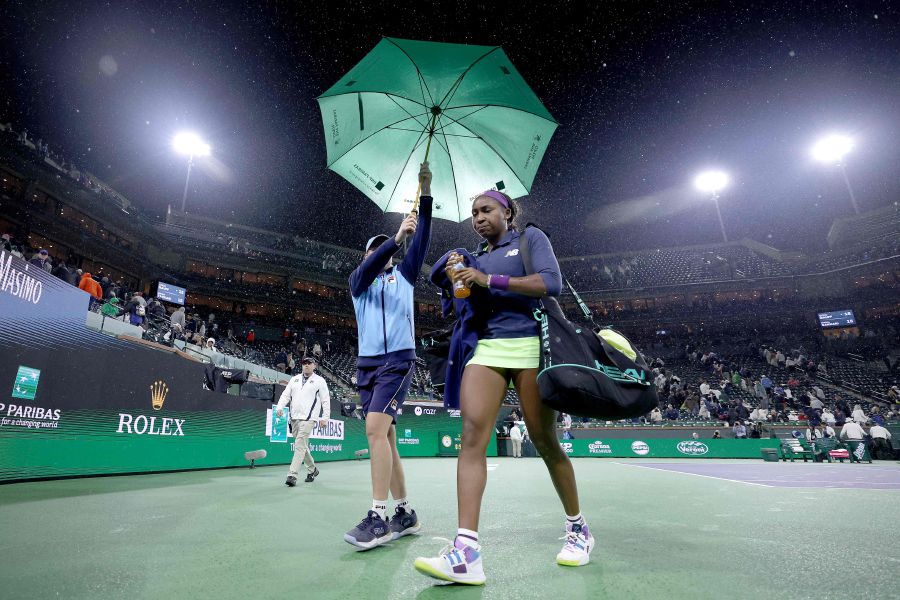 Coco Gauff of the United States walks off the court as rain suspends her match against Maria Sakkari of Greece during the Women's Semifinals of the BNP Paribas Open at Indian Wells Tennis Garden on March 15, 2024. - AFP pic