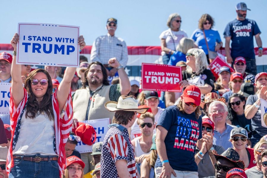 Supporters cheer ahead of former U.S. president Donald Trump's speech at the Waco Regional Airport on March 25, 2023 in Waco, Texas. - AFP Pic