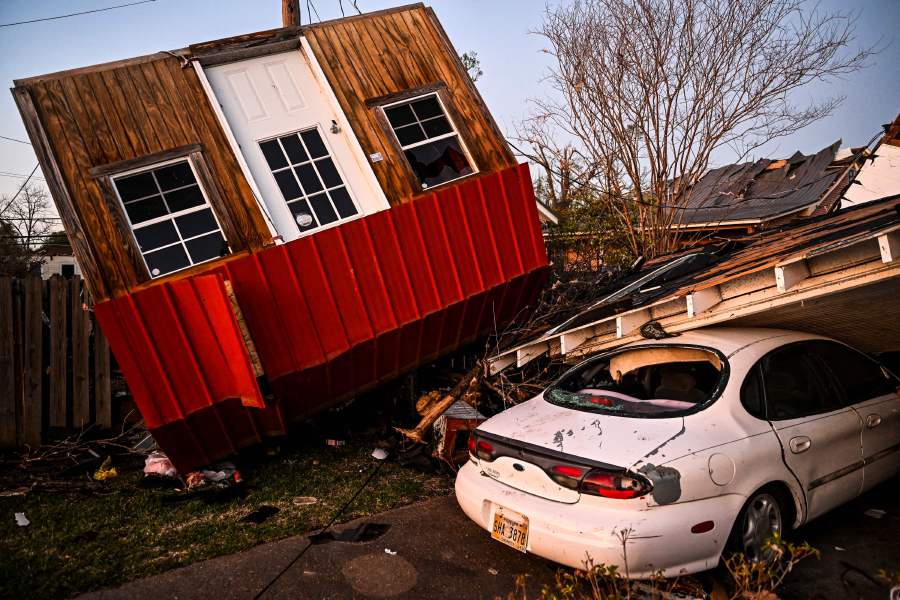 The remains of crushed house and cars are seen in Rolling Fork, Mississippi, on March 25, 2023, after a tornado touched down in the area. - AFP Pic