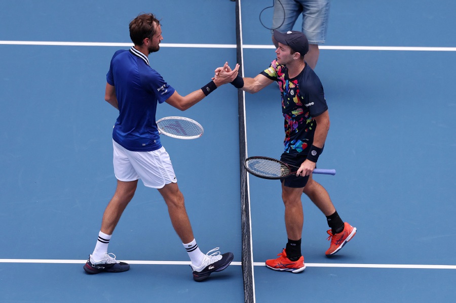 Daniil Medvedev meets Dominik Koepfer of Germany at the net after defeating him on day 11 of the Miami Open at Hard Rock Stadium on March 26, 2024. - AFP pic