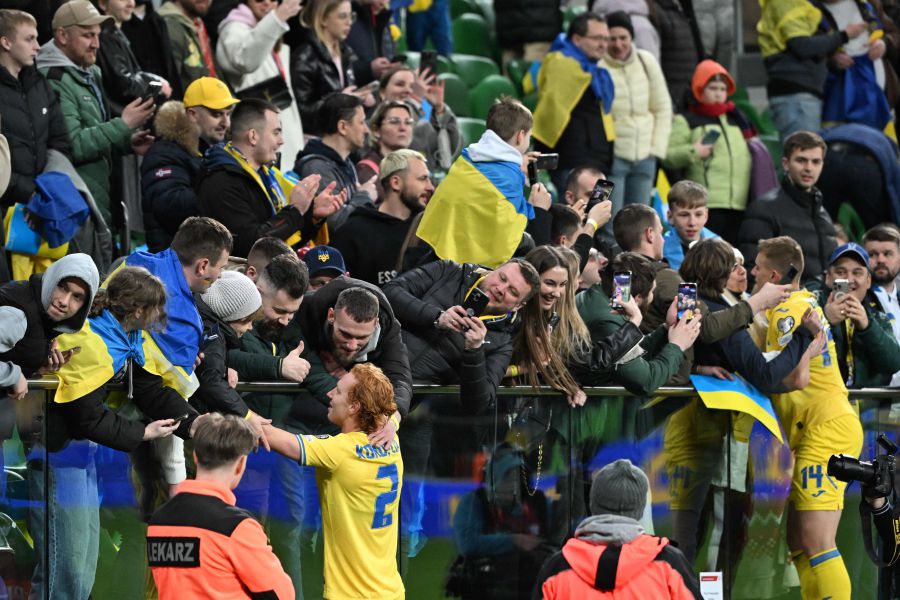 Ukraine's players celebrate with fans after the UEFA's EURO 2024 qualification final play off football match between Ukraine and Iceland, in Wroclaw, Poland, on March 26, 2024. - AFP pic