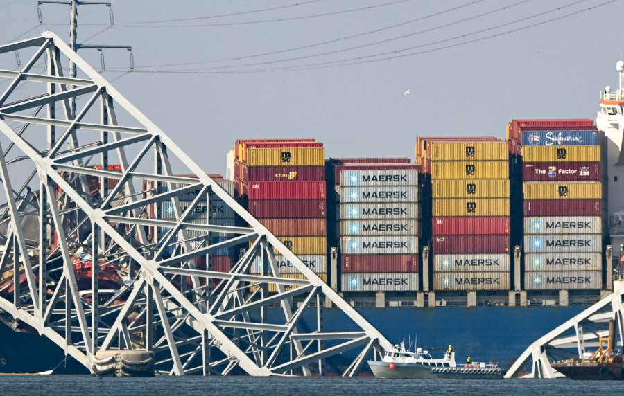 Cranes began arriving March 28 at the scene of the catastrophic bridge collapse over Baltimore harbor, as authorities shifted to a clean-up phase of the recovery and warned of extensive work before the major US port can reopen. - AFP pic