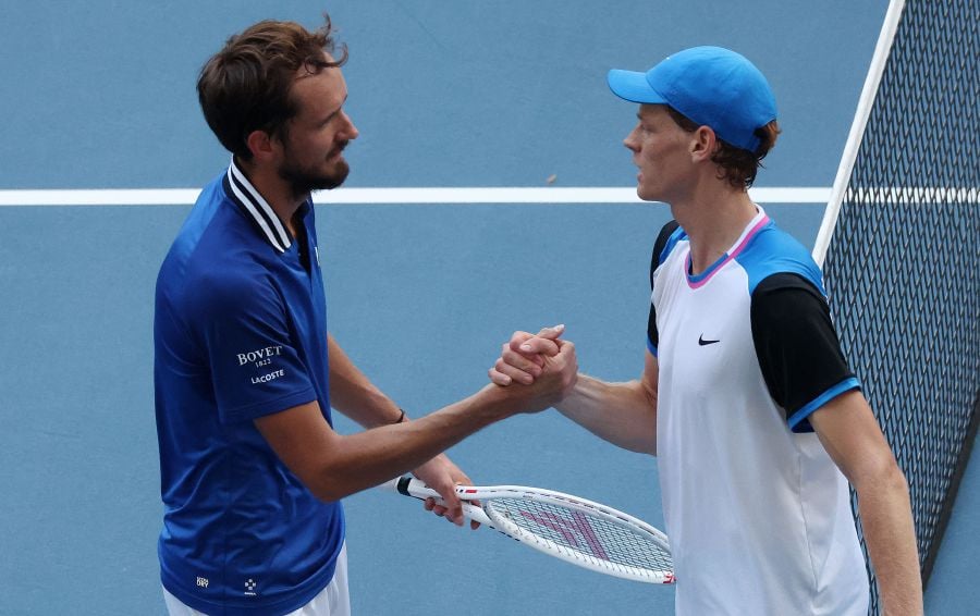 Daniil Medvedev and Jannik Sinner of Italy meet at the net after their match in which Sinner won on Day 14 of the Miami Open at Hard Rock Stadium on March 29, 2024 in Miami Gardens, Florida. - AFP pic