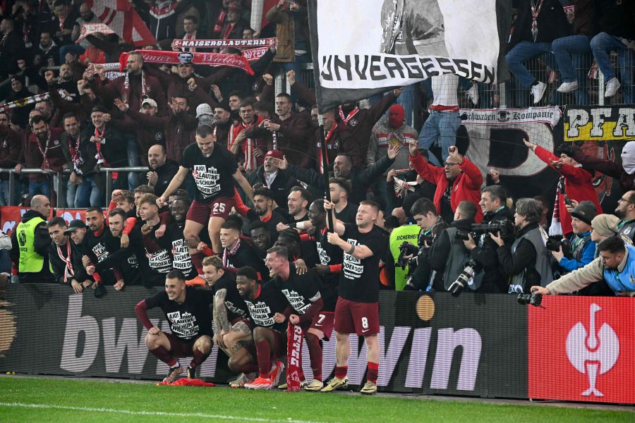 Kaiserslautern's players celebrate with fans after the team's 2-0 win during the German Cup (DFB Pokal) semi-final football match between 1 FC Saarbruecken and 1 FC Kaiserslautern at the Ludwigsparkstadion in Saarbruecken, western Germany on April 2, 2024. - AFP Pic