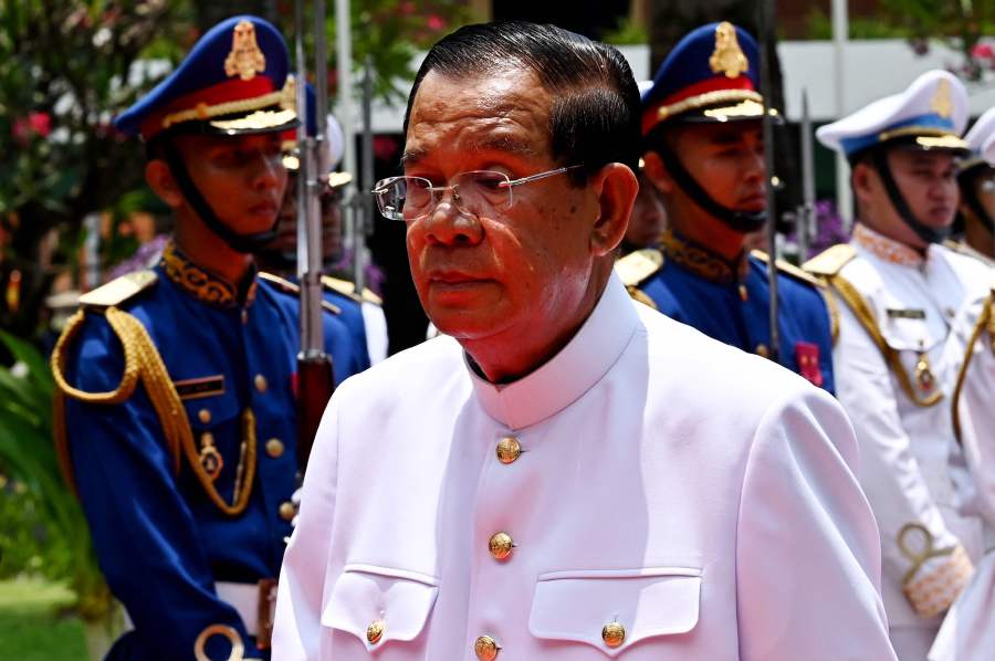 Cambodia's President of Senate Hun Sen walks past the honour guard at the Senate building after the first meeting of the Senate in Phnom Penh on April 3, 2024. Former. - AFP pic