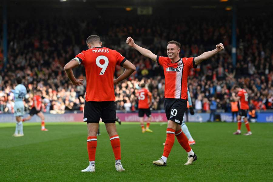 Luton Town's English striker #10 Cauley Woodrow (R) and Luton Town's English striker #09 Carlton Morris (L) celebrate after the English Premier League football match between Luton Town and Bournemouth at Kenilworth Road in Luton, north of London on April 6, 2024. - AFP Pic
