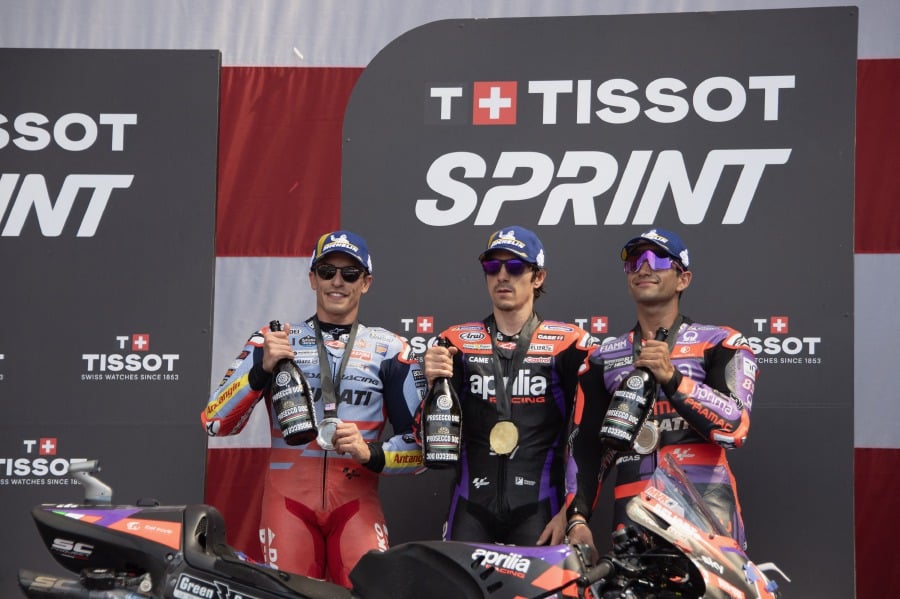 (L-R) Marc Marquez of Spain and Gresini Racing MotoGP, Maverick Vinales of Spain and Aprilia Racing and Jorge Martin of Spain and Prima Pramac Racing pose on the podium during the MotoGP Of The Americas - Sprint on April 13, 2024 at Circuit of the Americas in Austin, Texas. - AFP pic