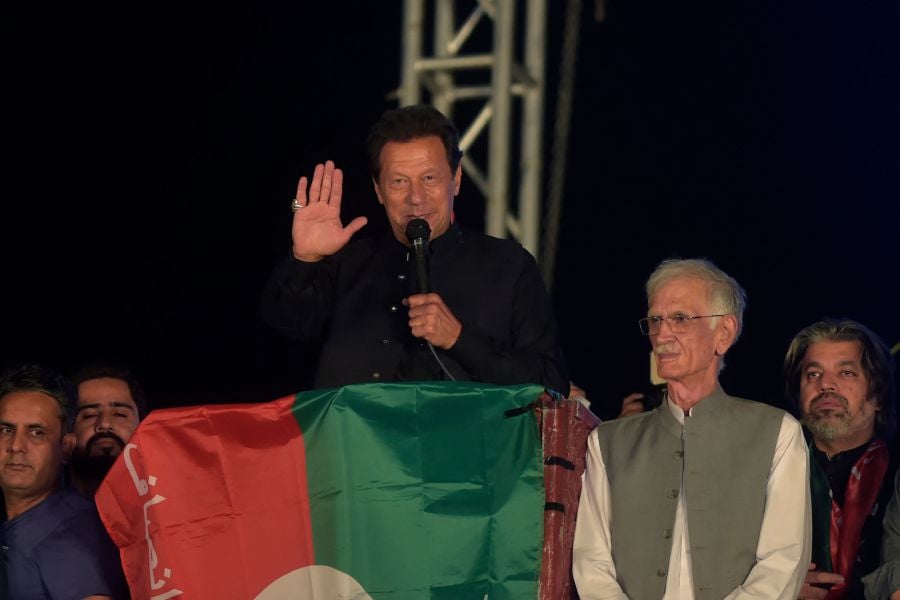 Ousted Pakistan's prime minister Imran Khan delivers a speech to Pakistan Tehreek-e-Insaf (PTI) party's supporters during a public rally in Peshawar on April 13, 2022. - AFP pic