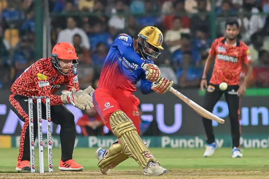 Royal Challengers Bengaluru's Mahipal Lomror (R) plays a shot during the Indian Premier League (IPL) Twenty20 cricket match between Royal Challengers Bengaluru and Sunrisers Hyderabad at the M Chinnaswamy Stadium in Bengaluru on April 15, 2024.- AFP pic